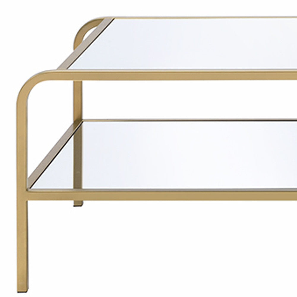 52" Clear and Gold Mirrored Glass And Iron Coffee Table With Shelf - Loft&Timber