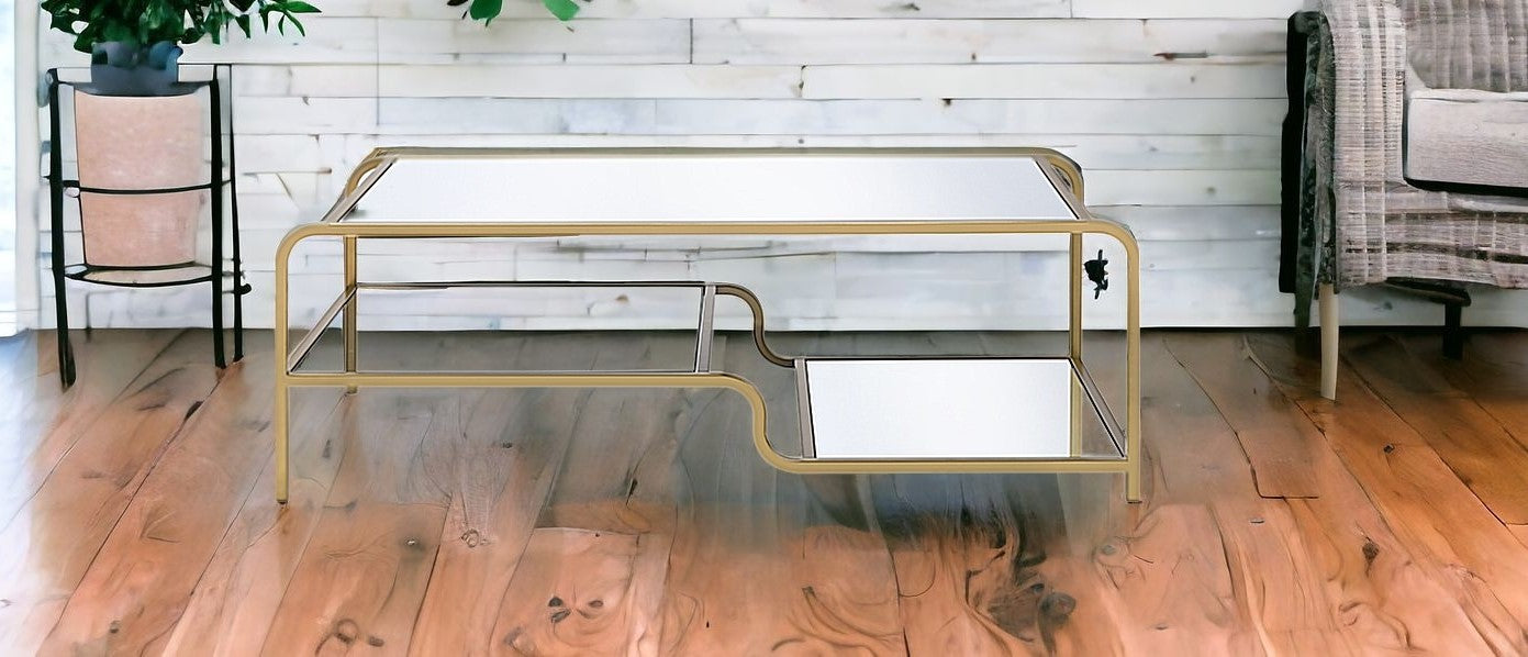 52" Clear and Gold Mirrored Glass And Iron Coffee Table With Shelf - Loft&Timber