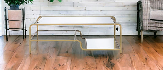 52" Clear and Gold Mirrored Glass And Iron Coffee Table With Shelf - Loft&Timber