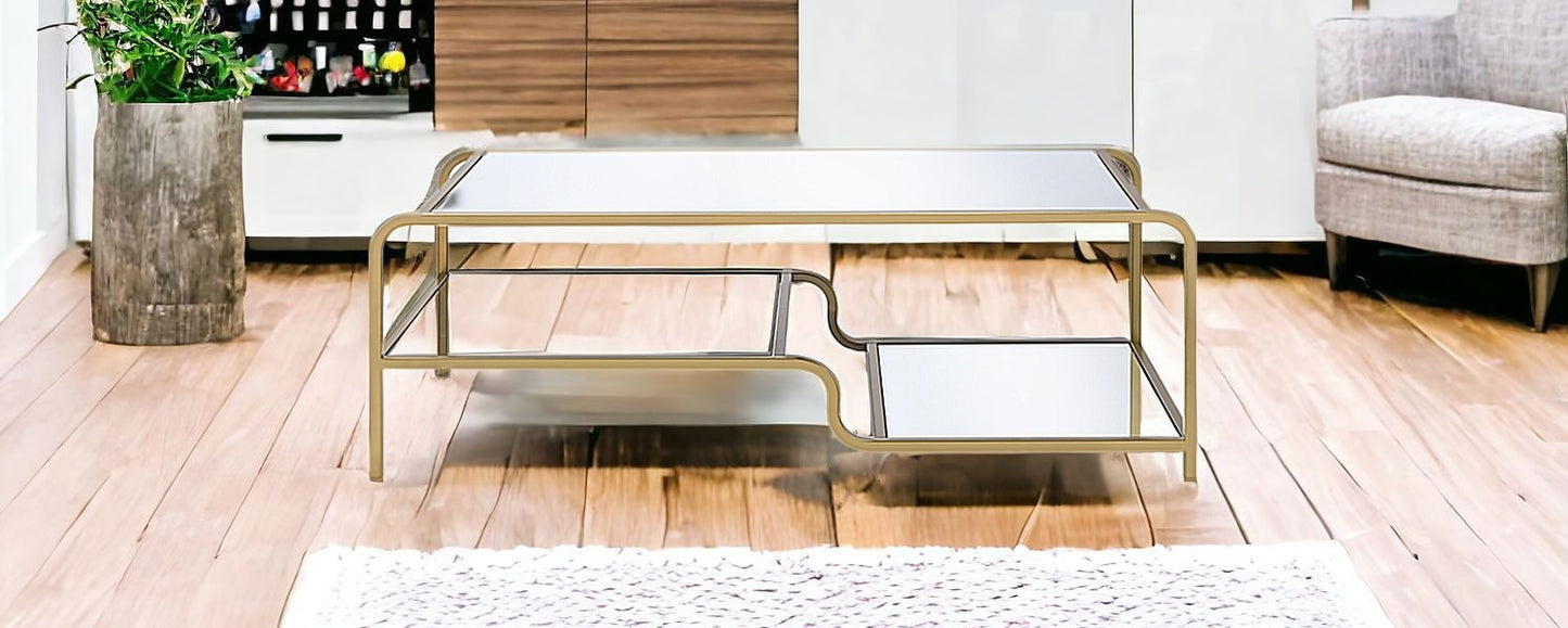 52" Clear and Gold Mirrored Glass And Iron Coffee Table With Shelf - Loft&Timber