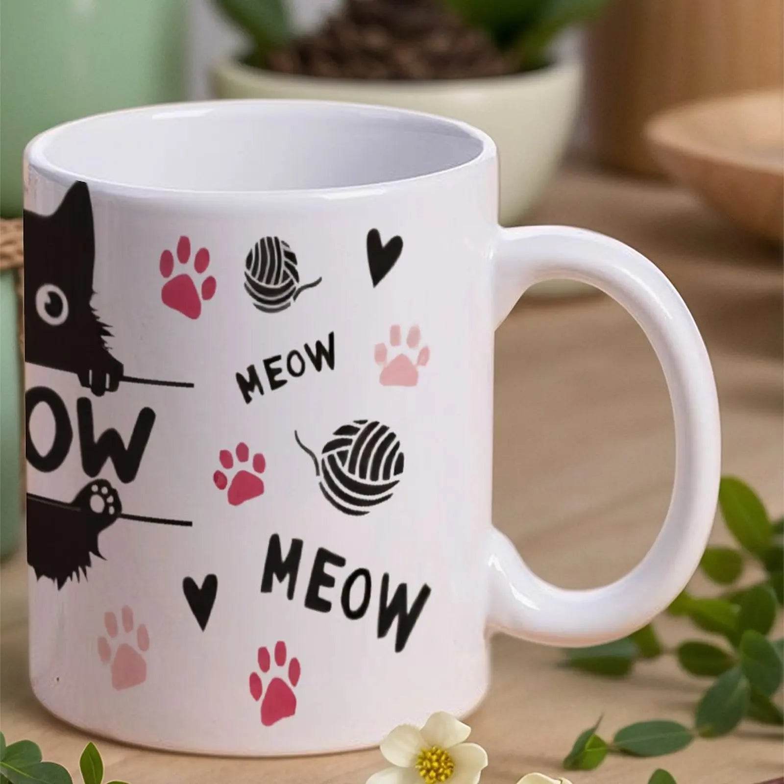 A Black Cat Sitting On Top Of A Bar With Paw Prints And The Word Meow Cup, 11oz Ceramic Cup - Loft&Timber