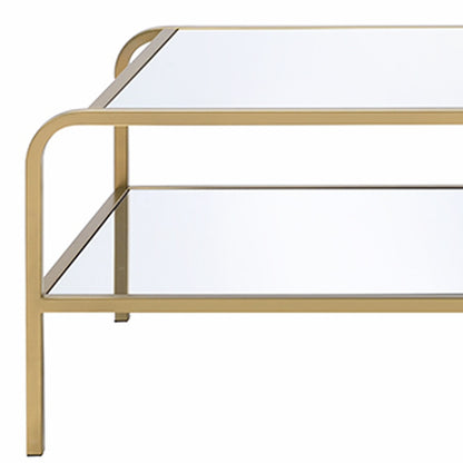 52" Clear and Gold Mirrored Glass And Iron Coffee Table With Shelf - Loft&Timber