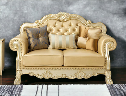 64" Bone And Gold Faux Leather Loveseat and Toss Pillows - Loft&Timber