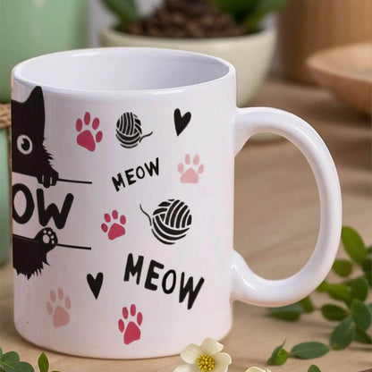 A Black Cat Sitting On Top Of A Bar With Paw Prints And The Word Meow Cup, 11oz Ceramic Cup - Loft&Timber