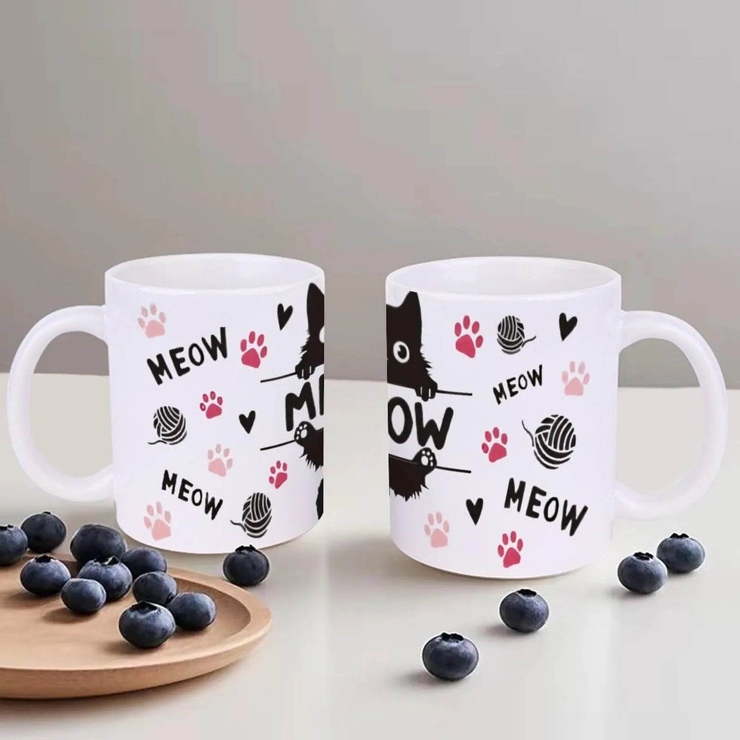 A Black Cat Sitting On Top Of A Bar With Paw Prints And The Word Meow Cup, 11oz Ceramic Cup - Loft&Timber