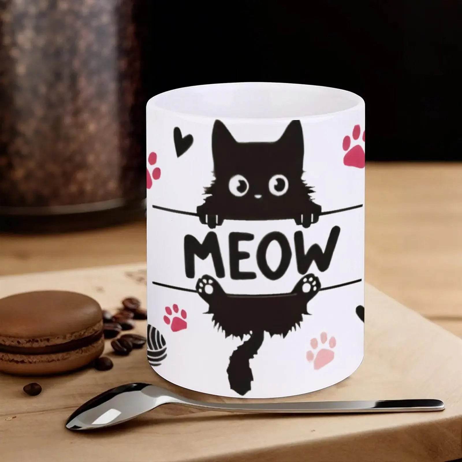 A Black Cat Sitting On Top Of A Bar With Paw Prints And The Word Meow Cup, 11oz Ceramic Cup - Loft&Timber